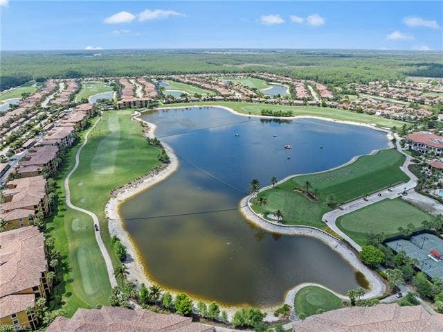 17921 Bonita National Blvd, #244, Bonita Springs, FL 34135 Aerial perspective showcasing a golf course community with extensive water features