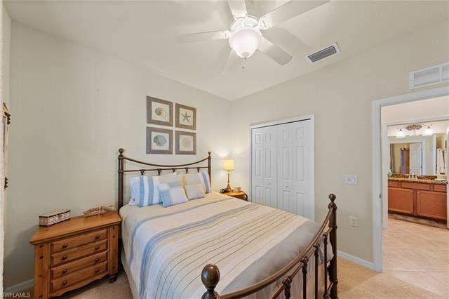 17921 Bonita National Blvd, #244, Bonita Springs, FL 34135 Carpeted bedroom featuring a ceiling fan, bi-fold closet doors, and recessed lighting