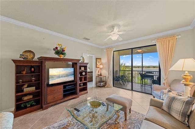17921 Bonita National Blvd, #244, Bonita Springs, FL 34135 Expansive living area featuring large format tile flooring, crown molding, and a ceiling fan