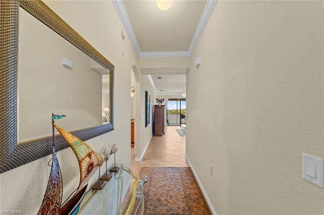 17921 Bonita National Blvd, #244, Bonita Springs, FL 34135 Hallway featuring neutral wall tones, crown molding, and recessed lighting
