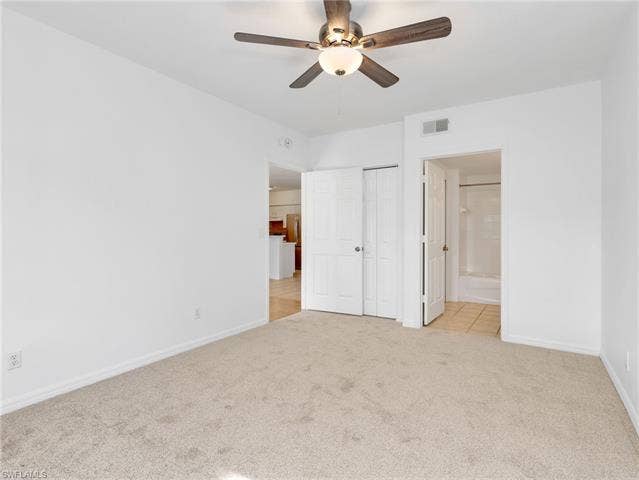 27087 Matheson Ave, #101, Bonita Springs, FL 34135 Guest Bedroom Suite with New Carpet & Ceiling Fan - Door To Bathroom & Another Door From Bathroom To Living Area/Entry
