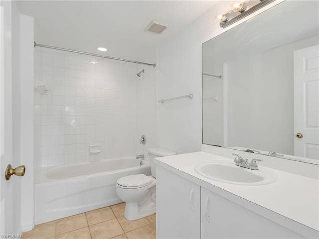 27087 Matheson Ave, #101, Bonita Springs, FL 34135 Primary Ensuite Bathroom with Tiled Tub/Shower Combo