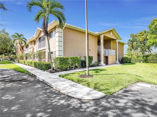 27087 Matheson Ave, #101, Bonita Springs, FL 34135 Front of the Building - Assigned Parking Space Within Steps