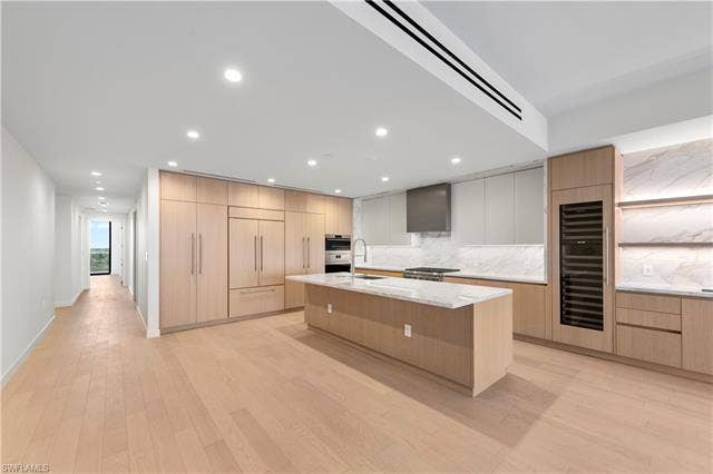 5100 Seagrass Blvd, #503, Bonita Springs, FL 34134 Italkraft Cabinetry, Polished Porcelain, ,Task Lighting, West Bar, 10' Island, 102 Bottle Dual Zone SubZero Wine Fridge