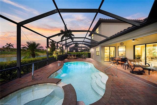 17211 Cherrywood Ct, Bonita Springs, FL 34135 Lanai with sunset