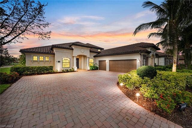 17211 Cherrywood Ct, Bonita Springs, FL 34135 Front with sunset