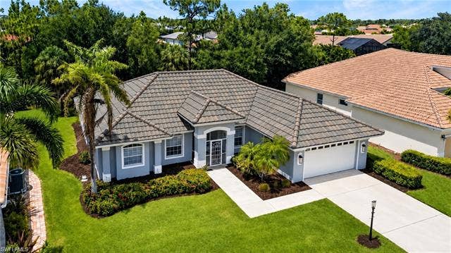 25020 Divot Dr, Bonita Springs, FL 34135 Picture shows what home will look like with new roof being installed Nov/2026.