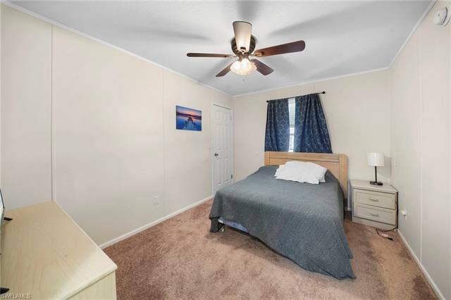 27472 Rue Viauv Ave, Bonita Springs, FL 34135 Neutral-toned walls complement the brown carpeted flooring