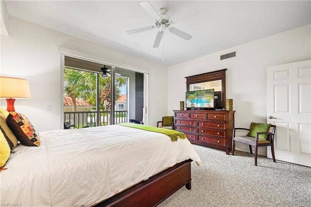 23461 Alamanda Dr, #206, Estero, FL 34135 Private screened balcony featuring tropical landscaping
