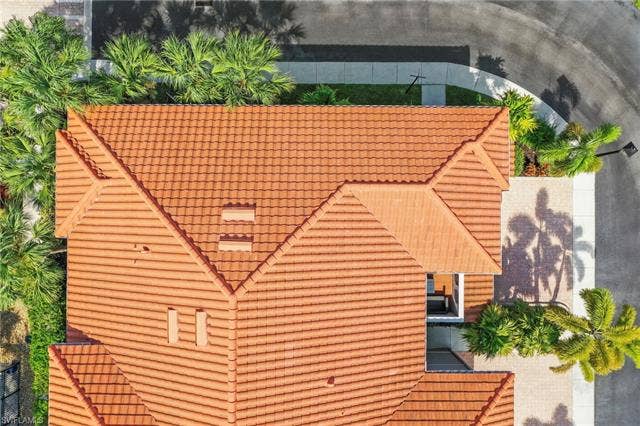 23461 Alamanda Dr, #206, Estero, FL 34135 Terracotta tile roofing with multiple gables and visible venting