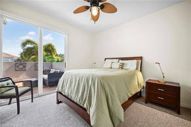 23461 Alamanda Dr, #206, Estero, FL 34135 Bedroom featuring neutral-toned carpeting and a ceiling fan with woven blades