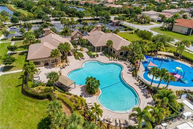10310 Carolina Willow Dr, Fort Myers, FL 33913 Lagoon-style swimming pool with surrounding patio