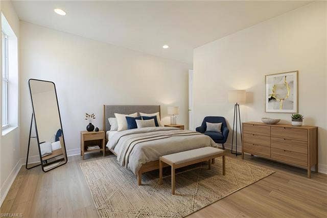 10310 Carolina Willow Dr, Fort Myers, FL 33913 Recessed lighting, light wood-finish flooring, and a large window