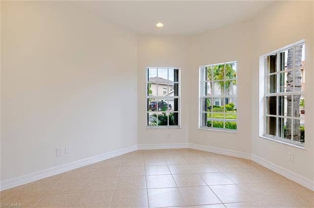 10310 Carolina Willow Dr, Fort Myers, FL 33913 Bay window alcove with recessed lighting, multiple windows, and neutral tile flooring