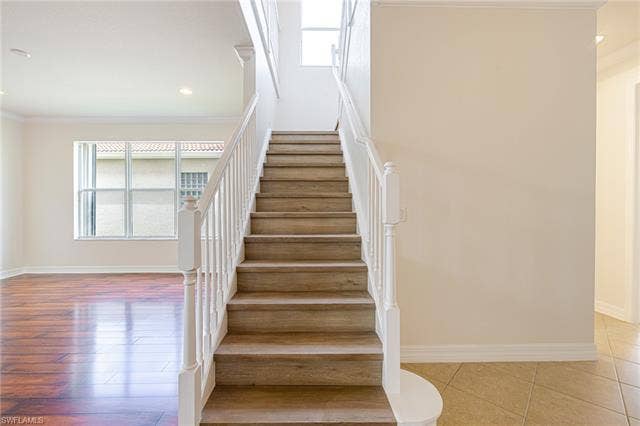 10310 Carolina Willow Dr, Fort Myers, FL 33913 Staircase with wood-finish treads and white balusters