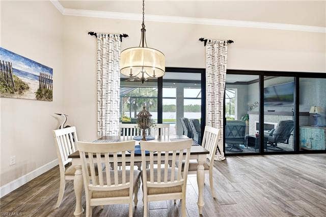 19125 Aqua Shore Dr, Estero, FL 33913 Dining area off of kitchen with beautiful lanai & lake view