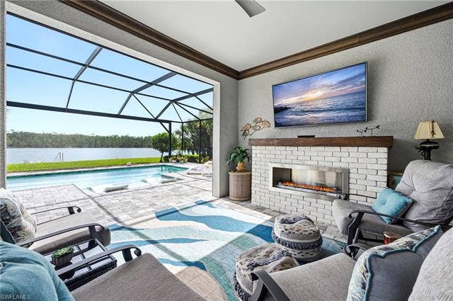 19125 Aqua Shore Dr, Estero, FL 33913 Enjoy your day on the screened lanai with built-in gas fireplace