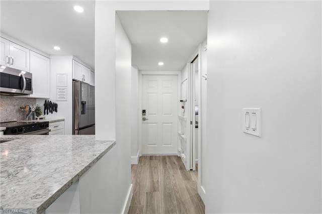 8300 Estero Blvd, #104, Fort Myers Beach, FL 33931 Entrance hallway - Virtually Edited Image