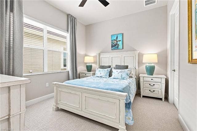 28410 Capraia Dr, Bonita Springs, FL 34135 High ceilings complement the neutral wall tones and light-colored carpet flooring