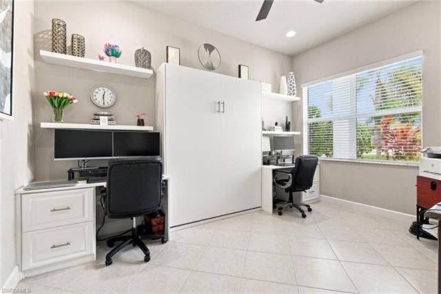 28410 Capraia Dr, Bonita Springs, FL 34135 Recessed lighting, ceiling fan, expansive window with blinds, tile flooring, and integrated wall unit