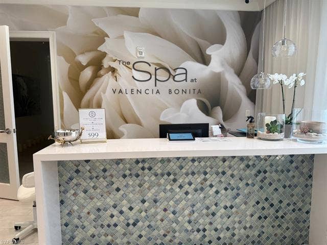 28410 Capraia Dr, Bonita Springs, FL 34135 Reception desk with a white countertop and mosaic tile facing