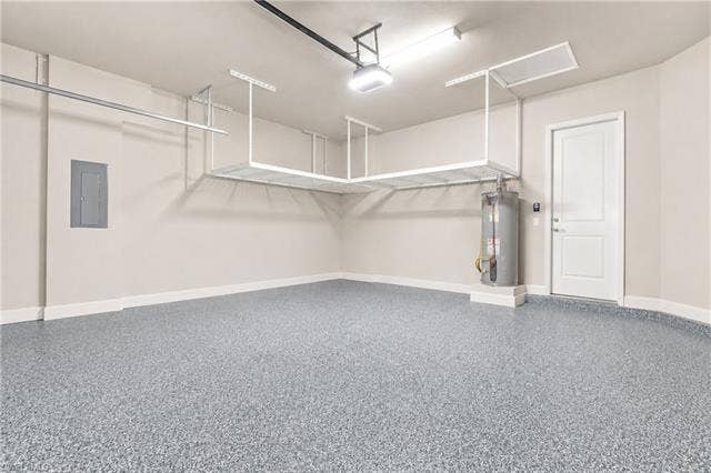 28410 Capraia Dr, Bonita Springs, FL 34135 Garage featuring epoxy flooring, built-in overhead storage, and a white panel door