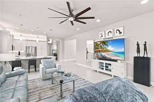 28410 Capraia Dr, Bonita Springs, FL 34135 Open-concept living area with tile flooring and a ceiling fan