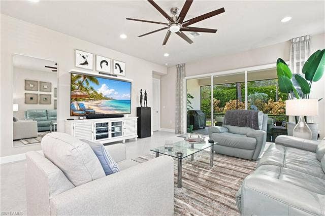 28410 Capraia Dr, Bonita Springs, FL 34135 Recessed lighting, wood-finish ceiling fan, and large format tile flooring