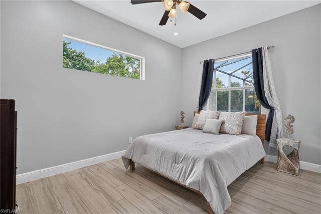 27150 Rue De Paix, Bonita Springs, FL 34135 Plank tile flooring, high ceilings with recessed lighting, ceiling fan, custom closet, window with view of spa and pool