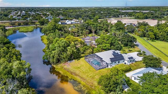 27150 Rue De Paix, Bonita Springs, FL 34135 Energy efficient home with solar panels, impact windows and doors, whole-house Generac generator with underground propane tank