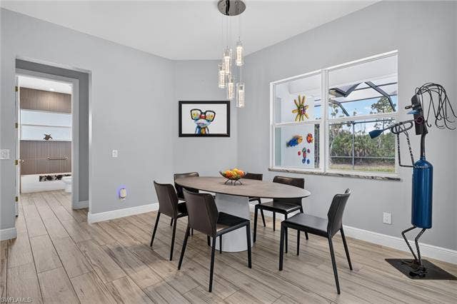 27150 Rue De Paix, Bonita Springs, FL 34135 Contemporary chandelier, spacious window with natural light