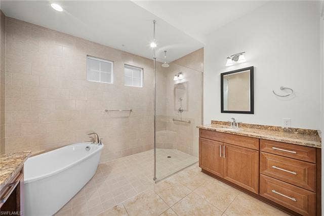 21450 Strada Nuova Cir, #A302, Estero, FL 33928 Soaking tub and walk in shower in main bathroom