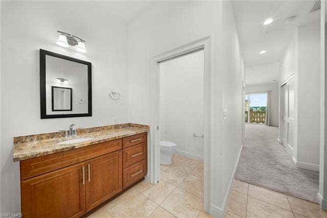 21450 Strada Nuova Cir, #A302, Estero, FL 33928 Dual vanities and sinks in main bathroom