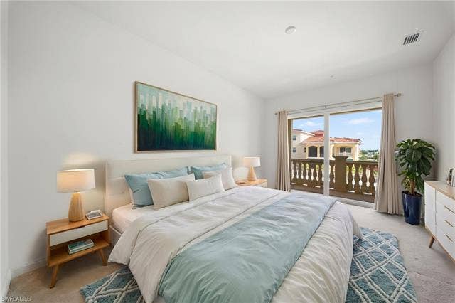 21450 Strada Nuova Cir, #A302, Estero, FL 33928 Main bedroom with sliding glass door to separate outdoor lanai