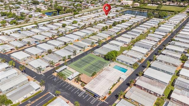 60 Palos Dr, Naples, FL 34104 Conveniently located near the community pool and recreational courts.