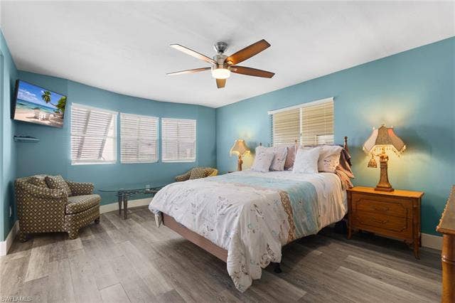60 Palos Dr, Naples, FL 34104 Spacious primary bedroom with room for an additional sitting area.
