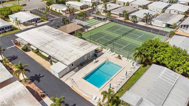 60 Palos Dr, Naples, FL 34104 Blue Skys community pool, tennis and pickleball courts.