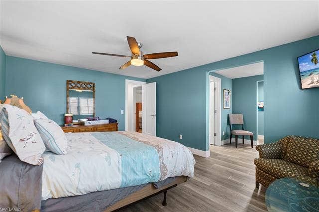 60 Palos Dr, Naples, FL 34104 Primary suite with updated finishes and access to a large walk-in closet.