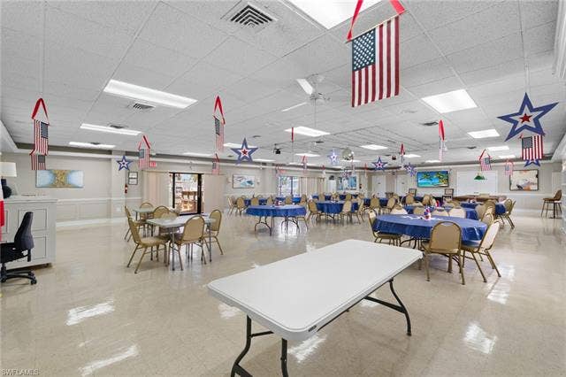 60 Palos Dr, Naples, FL 34104 Community recreation room with table tennis and space for organized activities.