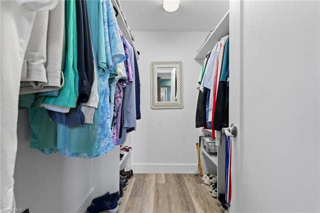 60 Palos Dr, Naples, FL 34104 Generously sized walk-in closet in the primary suite.