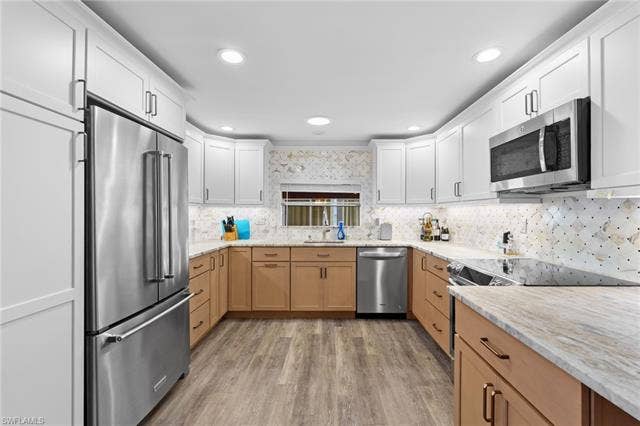 60 Palos Dr, Naples, FL 34104 Magazine-worthy remodeled kitchen with a polished, custom-home feel.