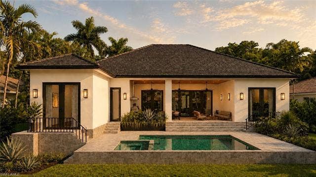 5219 S Seminole Ct, Cape Coral, FL 33904 (Rendered photo) Contemporary stucco exterior with a dark shingle roof, expansive patio, integrated swimming pool, and covered outdoor living area