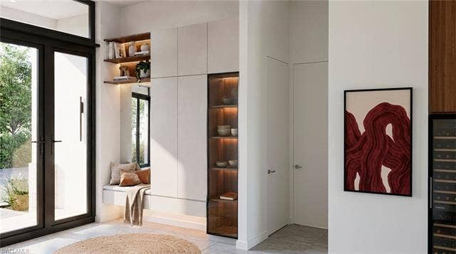 5219 S Seminole Ct, Cape Coral, FL 33904 (Rendered photo) Built-in shelving, integrated wine storage, and a window seat with storage