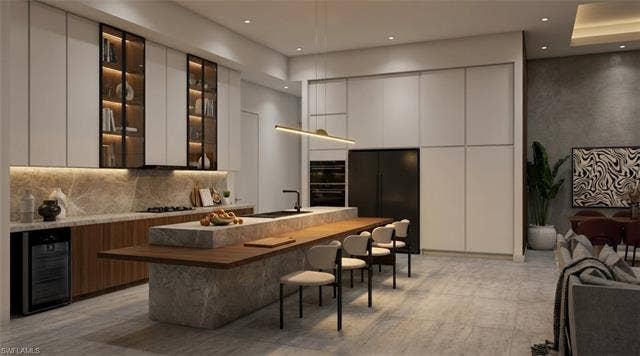 5219 S Seminole Ct, Cape Coral, FL 33904 (Rendered photo) Modern kitchen with stone island, wood-finish countertop, integrated appliances, and recessed lighting