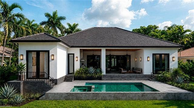5219 S Seminole Ct, Cape Coral, FL 33904 (Rendered photo) White exterior with a dark roof and black window frames