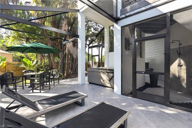 1195 Mockingbird Ln, Naples, FL 34104 Screened patio with spa and outdoor shower