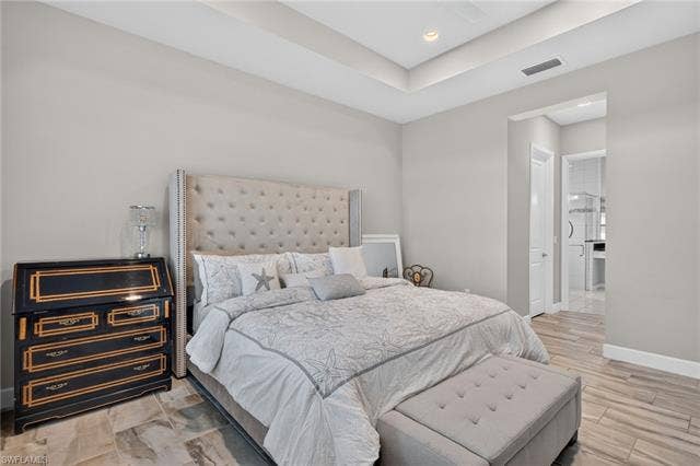 28405 Abruzzo Dr, Bonita Springs, FL 34135 His and Her walk-in closets in hallway to primary bath...