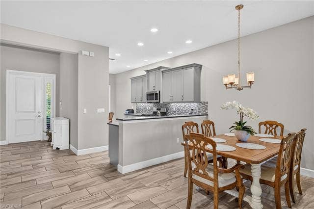 28405 Abruzzo Dr, Bonita Springs, FL 34135 There's also a breakfast nook in this Bristol villa! Kitchen features upgraded appliances (replaced garbage disp., dishwasher, and microwave in '25). Extra recessed lighting present in kitchen also.
