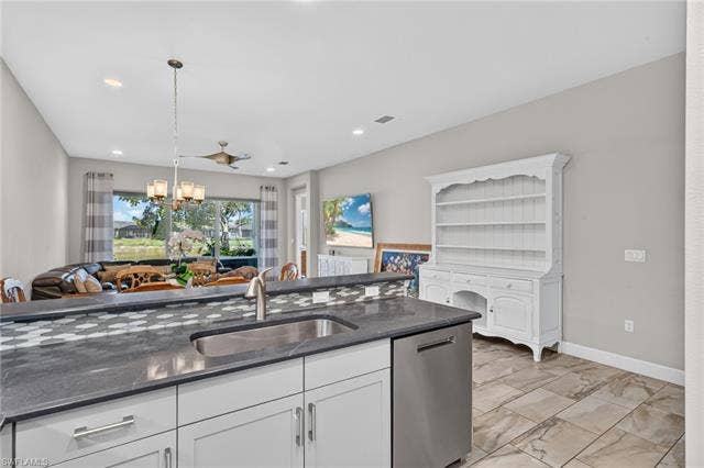28405 Abruzzo Dr, Bonita Springs, FL 34135 Oversized single sink present here. The higher ledge is a great area to put food when you are entertaining!