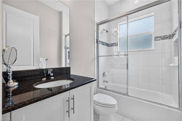 28405 Abruzzo Dr, Bonita Springs, FL 34135 Comfort height toilet and sink, plus floor to ceiling tile in shower with listello accent tile border!